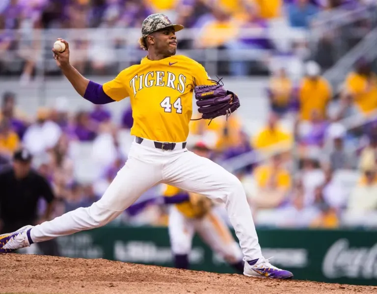 LSU Tigers baseball pitcher in bright yellow jersey with number 44 winds up to throw a pitch