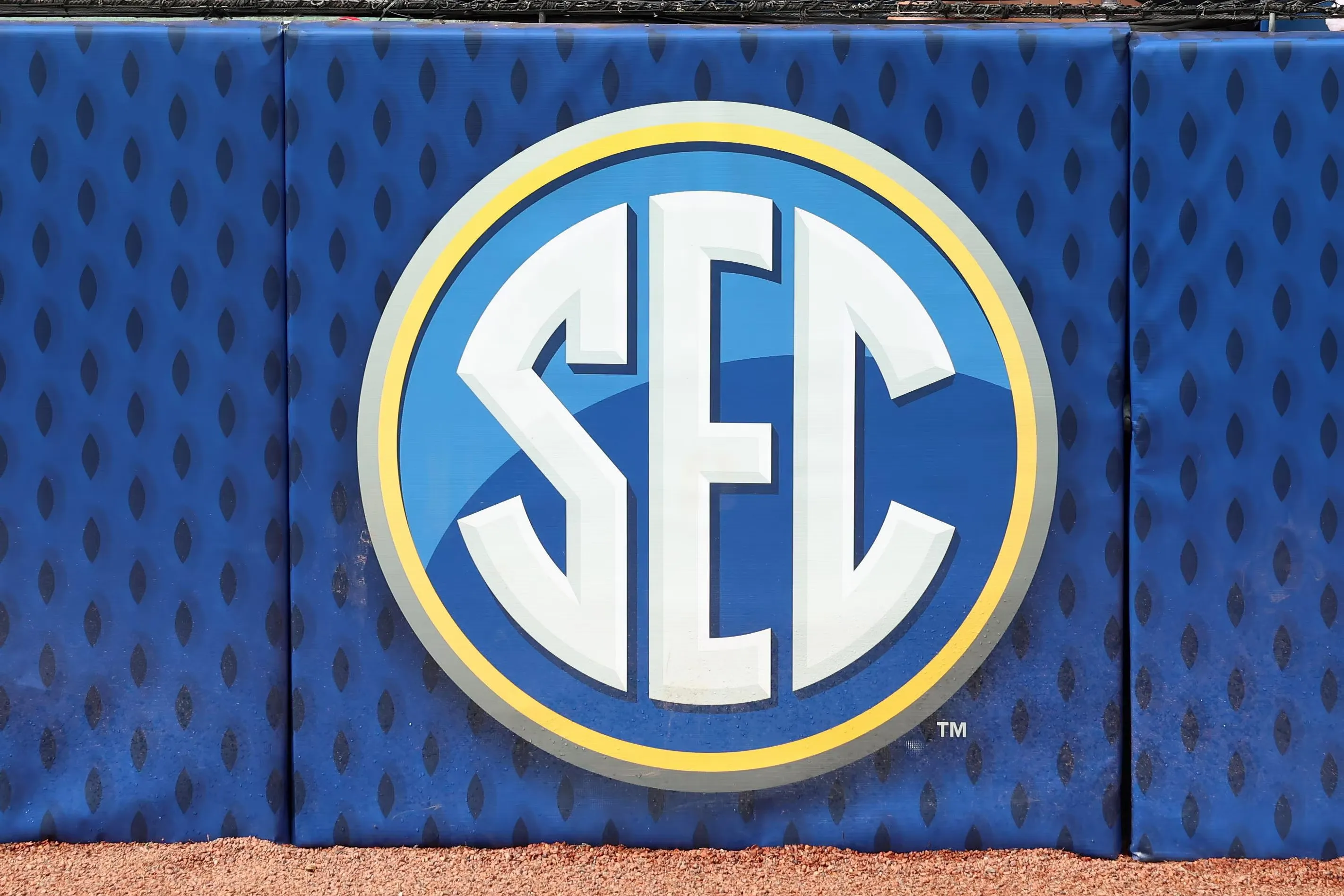 Southeastern Conference (SEC) baseball logo prominently displayed on stadium wall with bold white letters outlined in blue and gold
